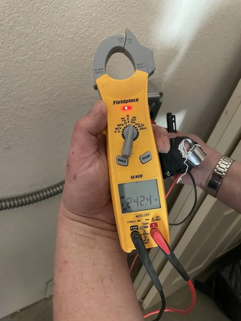 Voltage testing with clamp meter during Electrical Installation Services in Crozet
